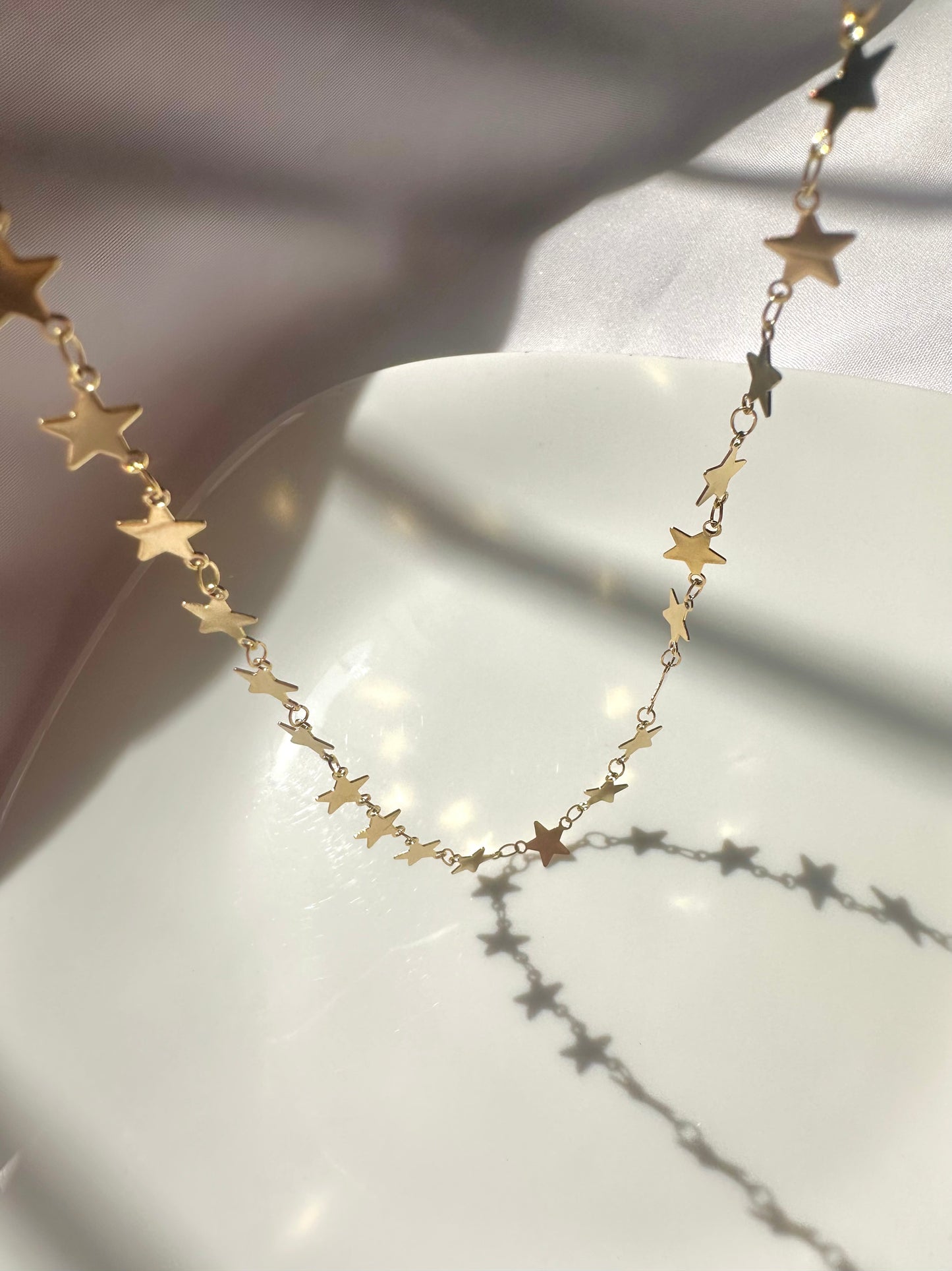Collar estrellas dorado